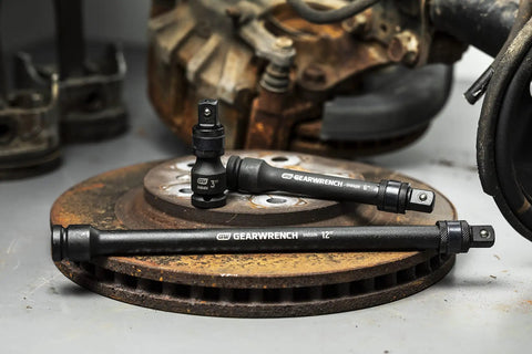 Locking 1/2 Inch Drive Impact Extension Set with 3 Inch, 6 Inch, and 12 Inch Extensions shown on brake rotors in workshop