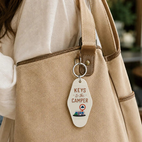 Four Piece Vintage Keychain Set For Camper RVs Retro Black And White Fobs Lightweight Durable Plastic Key Tags hanging on bag