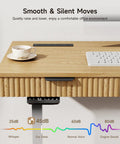 Smooth Operator Electric Standing Desk With Slim File Cabinet 63 Inch showing oak top, quiet motor control with coffee cup.