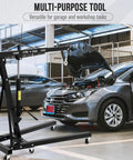 Heavy Hitter Foldable Hydraulic Engine Hoist Cherry Picker 4400 Lbs Capacity for use in garage with car hood raised.