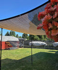 Mocha 90 Percent Outdoor Sun Shade For Patio 6 X 8 Ft Pergola Canopy With Grommets installed in a garden, HDPE shade cloth