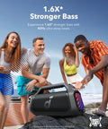 Boom 2 Plus Portable Speaker With 140W BassUp 2.0 on rocks at beach, group of friends enjoying music, outdoor party speaker