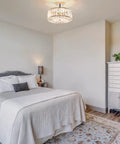 Modern Crystal Flush Mount Ceiling Light Fixture Dope With 12 Inch Round Crystal Shade in a bedroom with neutral decor