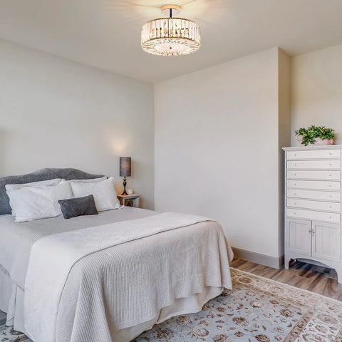 Modern Crystal Flush Mount Ceiling Light Fixture Dope With 12 Inch Round Crystal Shade in a bedroom with neutral decor