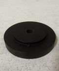 Badass Phenolic Measuring Wheel With A Tough 1/2 Inch Bore And Rock Solid 12 Inch Circumference Build, black circular base with center hole.
