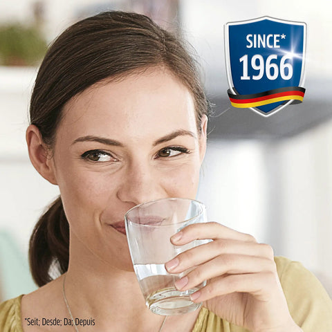 Woman enjoying fresh water from a glass, highlighting No Worries Water Filter Replacement Cartridges Pack Of Four For Pitchers And Coffee Pots.