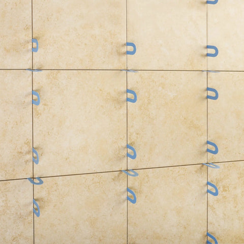 Horseshoe Tile Spacers For One Sixteenth Inch Grout Joint Pro Grade Pail Of Two Hundred Reusable Spacers In A Tub installed on tiles
