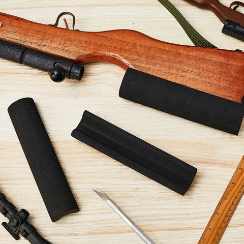 Black EVA pads shown on wooden rifle, part of 12 Pack Rifle Cheek Riser Pads Dope Non Slip EVA Foam 3 Height Levels For Buttstock Cover