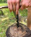 Person using Heavy Duty Hand Auger Wood Drill With Scotch Eye Design for bushcraft, creating hole in tree stump