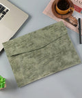 PU Leather A4 File Folder Waterproof Document Holder With Snap Closure Army Green on desk with laptop and newspaper