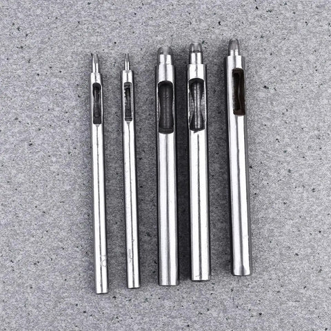 Leather Hole Puncher Set Five Piece With Steel Hollow Round Punch Tools 1-5mm on gray textured background