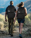 Two hikers wearing Heavy Duty 45L Tactical Backpack For Men With MOLLE System And 3 Day Bug Out Bag Design Rucksack For Hiking Camping Gym