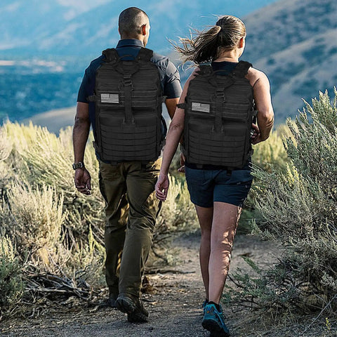 Two hikers wearing Heavy Duty 45L Tactical Backpack For Men With MOLLE System And 3 Day Bug Out Bag Design Rucksack For Hiking Camping Gym