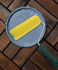 Texture Pattern Paint Roller Sponge Brush For Walls Ceilings And Home Painting Is A Total Gamechanger resting in paint tray.
