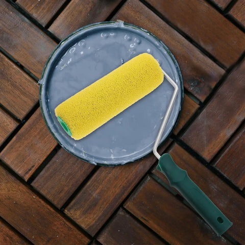 Texture Pattern Paint Roller Sponge Brush For Walls Ceilings And Home Painting Is A Total Gamechanger resting in paint tray.