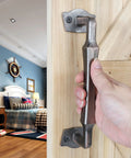 10 Inch Heavy Duty Rustic Sliding Barn Door Pull Handle In Oil Rubbed Bronze Finish on wooden door with hand gripping it