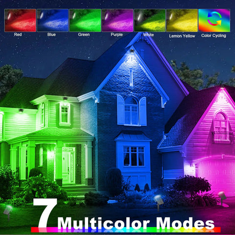 House illuminated with Outdoor Solar Color Changing Spot Lights Four Pack With Seven Modes Including Six Fixed Colors And Auto Change