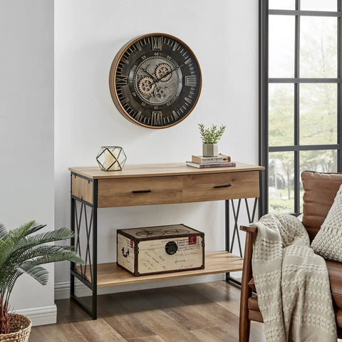 Killer Twenty Four Inch Oversized Wall Clock Featuring Real Moving Gears Heavily Distressed Antique Gold Dial Bold Roman Numerals above wooden table.