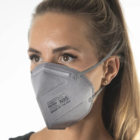 Woman wearing N95 Disposable Respirator Mask Made In USA Super Comfy Fit Breathable Skin Friendly Nonwoven Fabric NIOSH Approved