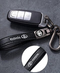 Premium Leather Car Keychain Set For Toyota Corolla RAV4 Highlander features a sturdy black key strap and ignition fob.