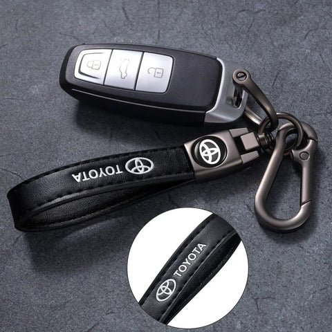 Premium Leather Car Keychain Set For Toyota Corolla RAV4 Highlander features a sturdy black key strap and ignition fob.