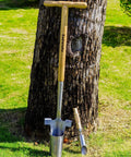 Long Handled Bulb Planter Tool With Depth Marker And Sharp Teeth For Tulips Daffodils And Other Flowers Easy Knee Free Transplanter And Sod Plugger For Garden Pro Plugging And Quick Planting displayed against a tree