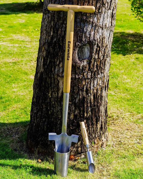 Long Handled Bulb Planter Tool With Depth Marker And Sharp Teeth For Tulips Daffodils And Other Flowers Easy Knee Free Transplanter And Sod Plugger For Garden Pro Plugging And Quick Planting displayed against a tree