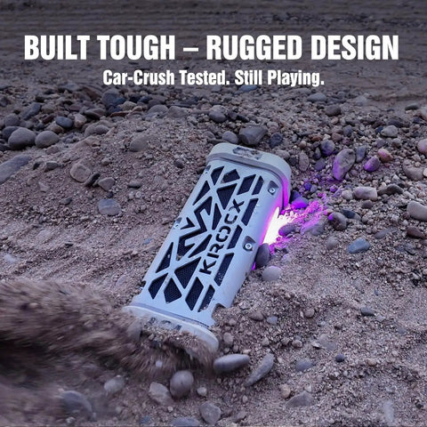 Rugged Aluminum Bluetooth Speaker With 45W Power Deep Bass IP68 Waterproof Magnetic Mounting TWS Pairing Long Battery Life Go To Outdoor Speaker For Golf Carts Camping And Beach Adventures In A Cloud Dancer Metallic Finish on rocky terrain