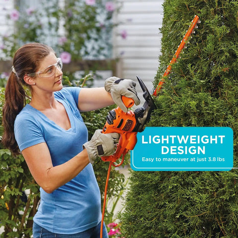 Person using Powerful 3.0 Amp Electric Hedge Trimmer With 16 Inch Blade Lightweight Compact Corded Yard Tool on bush