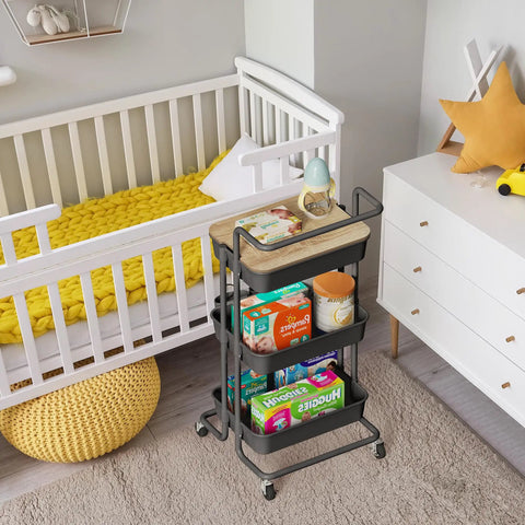 Three Tier Rolling Utility Cart With Cover Top And Wheels For Office Kitchen Bathroom On The Go Storage Cart Includes Three Baskets Six Hooks Three Cups And A Lid Top For Laptop Coffee Crafts And More Black beside a crib.