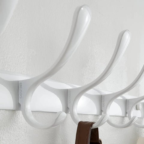 Close-up of Six Hook Wall Mounted Coat Rack In White Stainless Steel Finish For Coats Hats Bags installed on wall