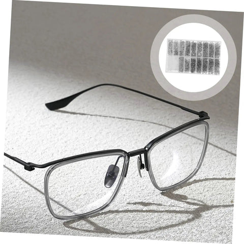 Black eyeglass frames with a highlight of the 10-piece nose pad set attachment option in stainless steel.