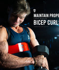 Man using Arm Blaster For Bigger Biceps With Thick Aluminum Build Contoured Padded Edges Adjustable Elbow Posture Support