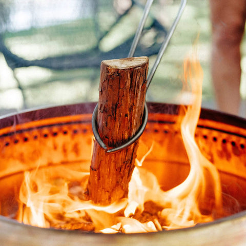 Juniper Aromatic Firewood For Outdoor Fire Pits And Backyard Fires Kiln Dried Logs in fire pit with flames