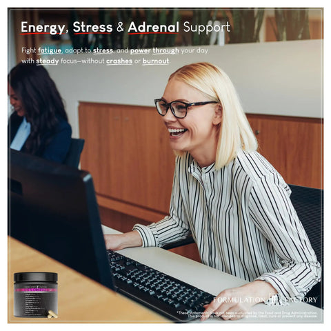 Woman smiling while using a computer with She's Obsessed Vitality Complex for hormone balance and mood support visible in corner