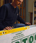 Worker using Extendable 36 Inch Level With Locking Design And Continuous Marking Edge Type 80T for framing a window opening