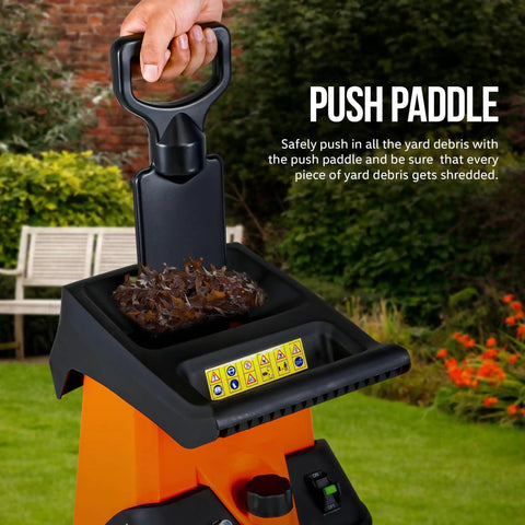 Leaf Shredder Mulcher Corded Electric With 15A 1800W Motor 17 To 1 Reduction dual edge blades shown with push paddle in use