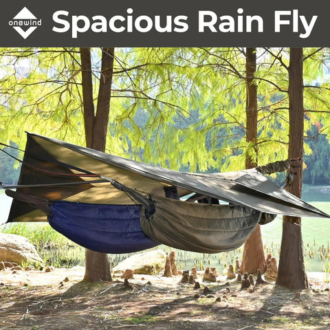 12 By 10 Ft Ultralight Camping Hammock Tarp Rainfly with doors setup between trees for all weather protection by a lake