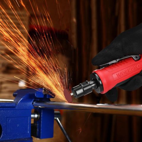 WORKPRO 1/4-inch pneumatic straight die grinder, red, side view, held by gloved hand grinding metal with sparks.