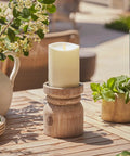Outdoor Flameless LED Ivory Candle With Real Moving Flame And Melted Edge 3.75 Inch By 5 Inch Battery Operated Timer on wooden stand