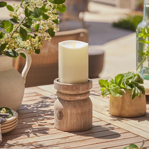 Outdoor Flameless LED Ivory Candle With Real Moving Flame And Melted Edge 3.75 Inch By 5 Inch Battery Operated Timer on wooden stand