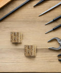 Heavy Duty Metal Cabinet Hinges for Corner Cabinets with 180 Degree Opening, hardware and tools on wood surface