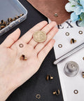 Hand holding components from 20 Piece Boot Hook Kit With Brass Shoelace Eyelets And Rivets, Press Stud Tools Set
