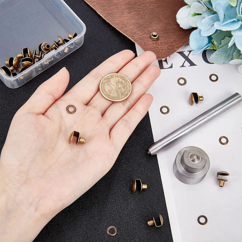 Hand holding components from 20 Piece Boot Hook Kit With Brass Shoelace Eyelets And Rivets, Press Stud Tools Set
