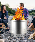 Heavy Duty 27 Inch Fire Pit Kit With 304 Stainless Steel Build in use during a camping hangout with friends