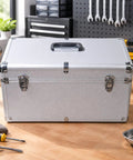 Silver Metal Tool Case With Ergo Grip Carrying Handle And Reinforced Corner Guards Built Different For Reliability During Harsh Field Repairs And Gear Storage With Multiple Secure Locking Clasps To Keep Your Wrenches Safe, closed view on workbench.