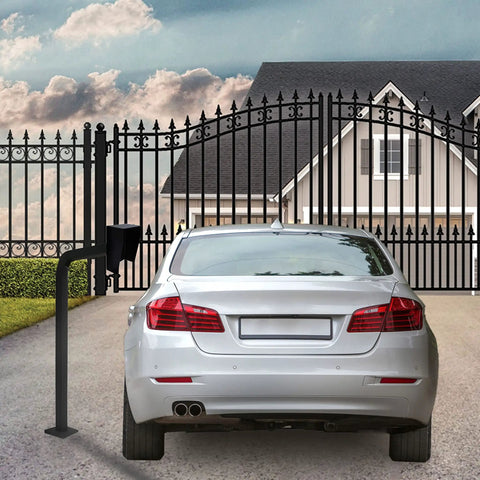 Beefy Universal Gate Keypad Mounting Post For Swing And Sliding Openers next to a closed metal gate and parked car