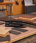 3 Piece Center Punch Set With 4 Inch High Carbon Steel Black Finish Pro Grade Hand Tools displayed on workbench with wood and alloy surfaces
