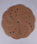 Super Tough 40 Piece 5 Inch Ultra Fine Aluminum Oxide Sanding Discs With Eight Hole Hook Loop Backing For Random Orbital Sanders And Auto Detailing Jobs In Assorted Grits 60 To 240 For Smooth Woodwork And Finish Work, arranged in a circular pattern.