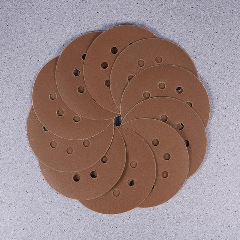 Super Tough 40 Piece 5 Inch Ultra Fine Aluminum Oxide Sanding Discs With Eight Hole Hook Loop Backing For Random Orbital Sanders And Auto Detailing Jobs In Assorted Grits 60 To 240 For Smooth Woodwork And Finish Work, arranged in a circular pattern.